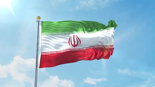Waving Flag of Iran Against Blue Sky
