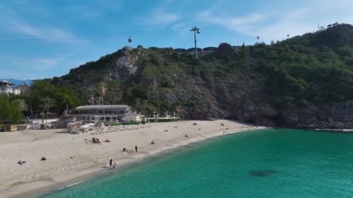 Aerial Video of a Stunning White Sand Beach Meeting the Azure Blue Sea With Gentle Waves Rolling to