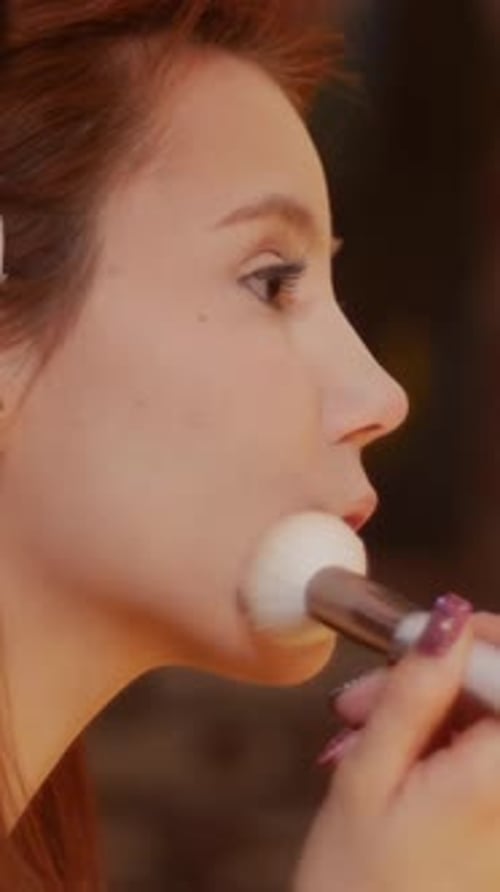 Woman Applies Makeup With Brush For Beauty