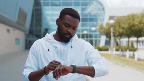 Handsome Young African American Man Use Smartwatch Stand Street Business Shopping Internet Face