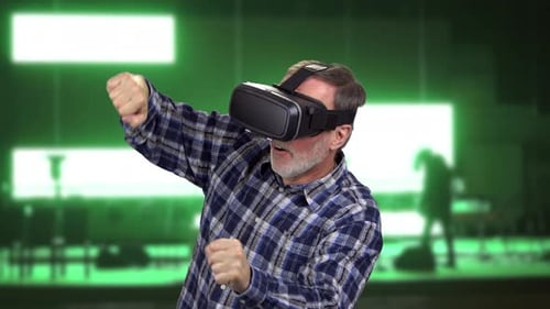 Senior Man in Vr Headset Riding a Bike in the Virtual Reality