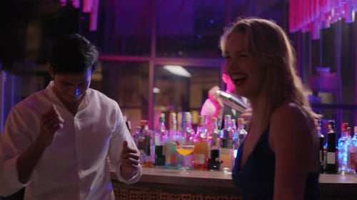 Group of multiethnic friends having fun, dancing with music in a bar.