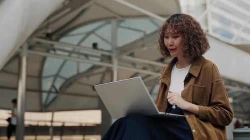 Woman on Laptop Video Call Outdoors