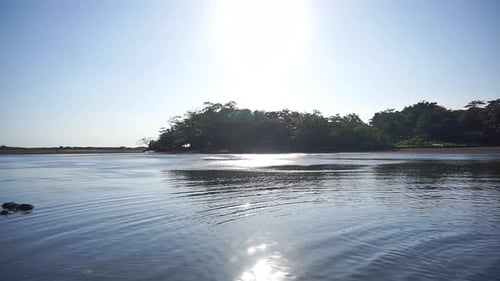 vertical video sunset view on the sea with small waves, beautiful natural panorama in the afternoon