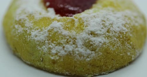 Zoom in close up move view of Christmas cookies in the form of a wheel decorated with sugar on its y