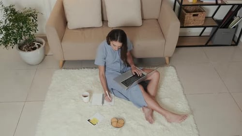 Young Female Home Office Worker Typing on Laptop Keyboard