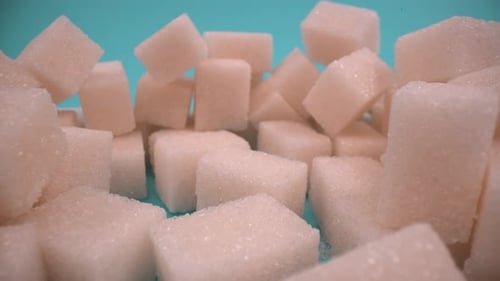 Sugar cubes close up on isolated 4K