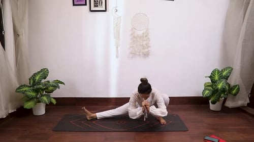 Woman Doing Side Lunge Yoga at Home