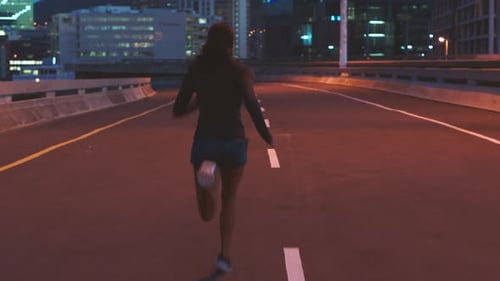 Woman runner, night and city street workout for cardio fitness race or competition practice