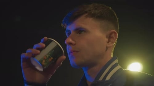 Solitary Individual Pauses on City Street Contemplating Under Glowing Lamps Nighttime Urban