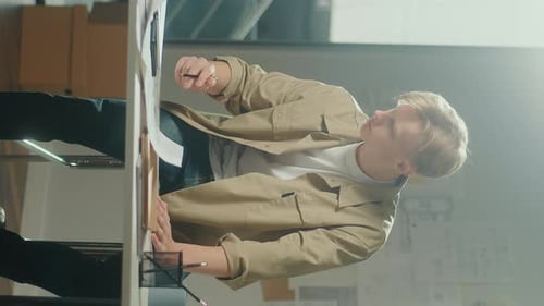 Vertical VideoCreative Man Doing Project Sitting at Office Sketching Plan