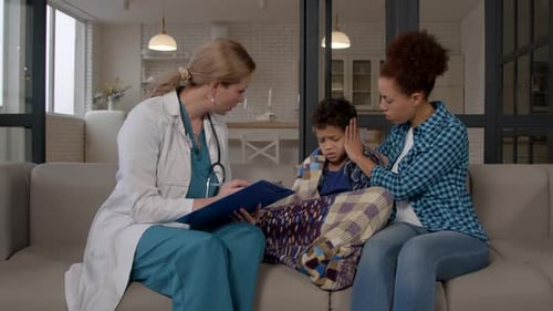 Doctor Visits Boy and Mother at Home