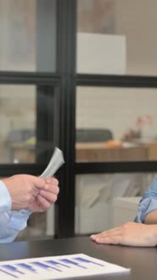Young Man Gives Money to Old Man and Shakes Hand, vertical video