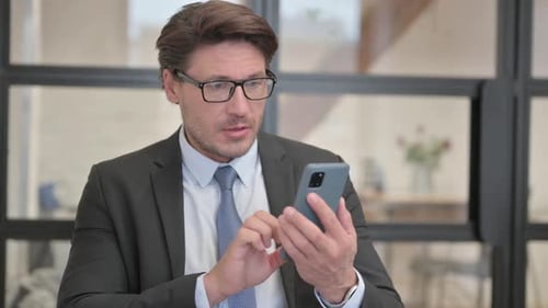 Man Reacts to Good News on Phone