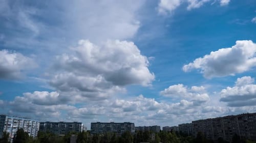 Timelapse of Clouds in the Blue Sky Moves Over the City