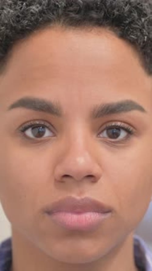 Close up of Smiling African Woman Face, vertical video