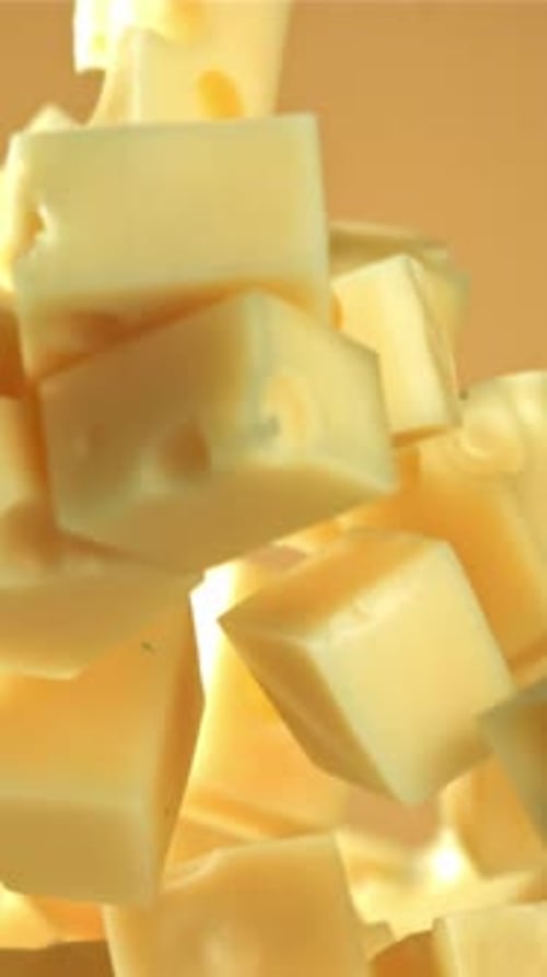 Super Slow Motion Pieces of Cheese Fly Up and Fall Down Filmed on a Highspeed Camera at 1000 Fps
