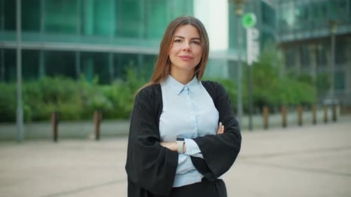 Portrait of a Smiling Businesswoman Against the Background of a Business Center