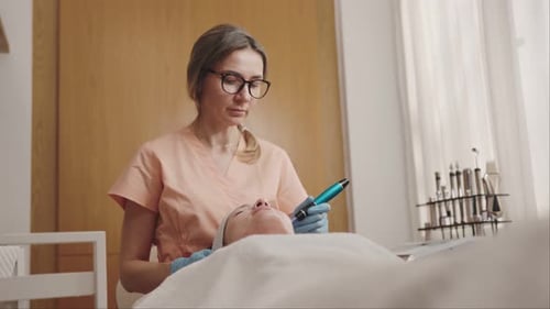 Woman Receiving a Facial Treatment in Spa Setting