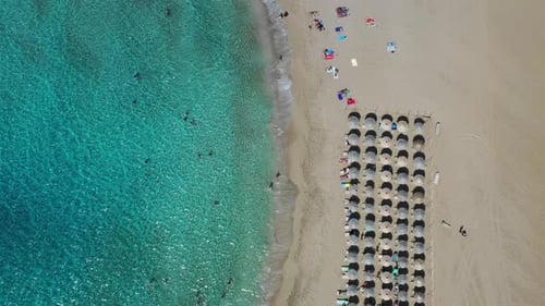 Aerial drone video of Falassarna beach, crystal waters, golden sand, endless sandy turquoise beach o