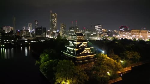 Aerial video of the Hiroshima skyline with Hiroshima Castle in Japan