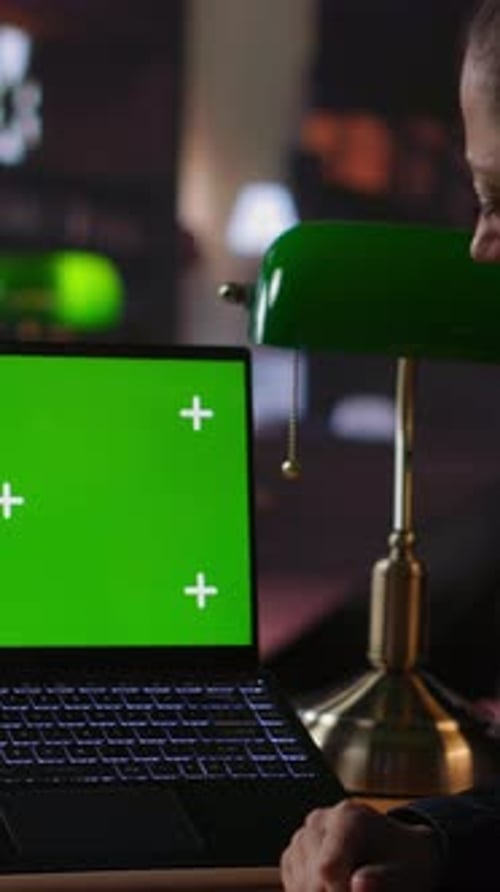 Woman Thinks in Front of Green Screen Laptop