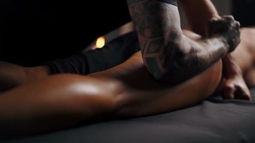 Relaxing Massage for Muscular Woman on Table