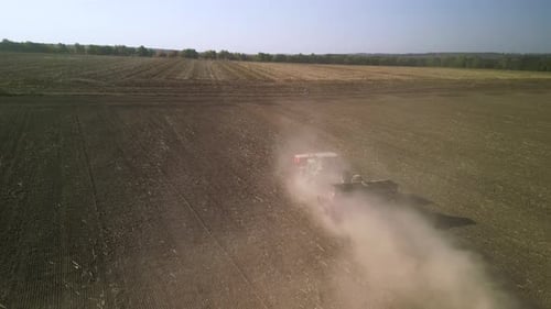Tractor on the field seeding wheat