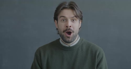 Man Expressing Surprise and Happiness Close Up