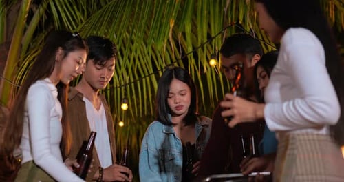 Friends Chatting at Night Time Gathering