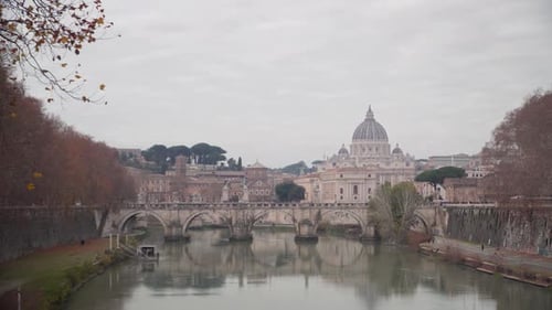 Camera shot of river Tiber in Rome and Basilica di San Pietro