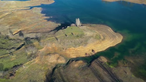 Aerial drone view of low levels of water in the lake. Shortage of water. Climate change.
