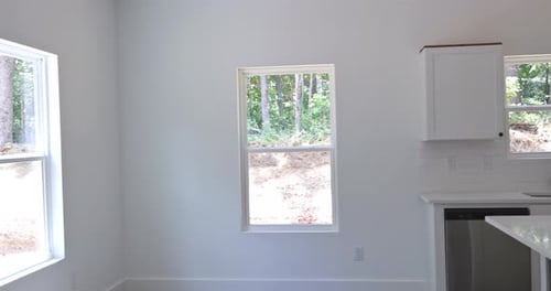 Tracking Shot Through Modern Minimalist White Kitchen