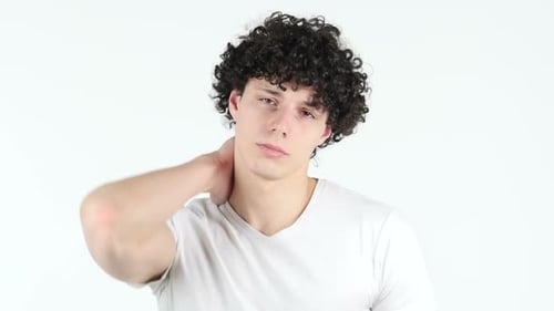 Young Man Massages Sore Neck Muscles for Relief