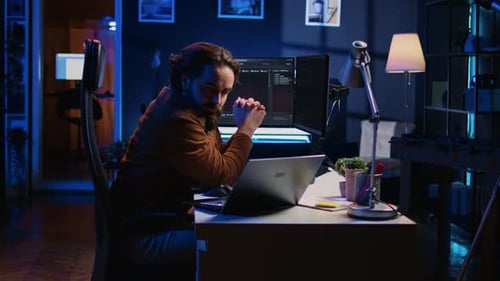 IT Professional Doing Multitasking in Apartment Office While Listening Music