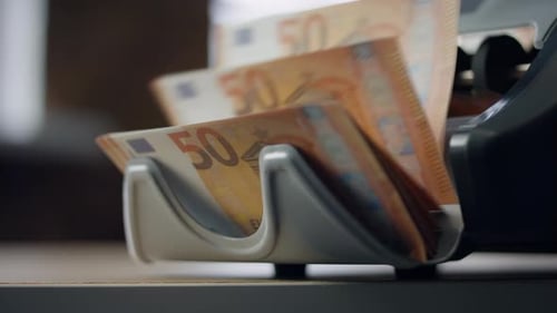 Euro Bills Calculating by Electronic Counter Close Up Indoors. Automatic Equipment Counting