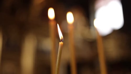 Candle Flames Flickering in the Darkness