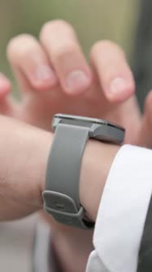 Close up of Businessman using Smart Watch Outdoor, Vertical Video