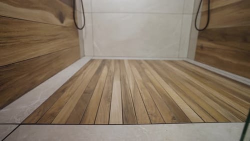 Premium wooden slat shower floor. Luxury bathroom.