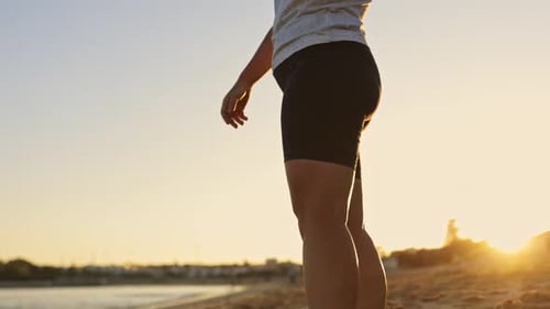 Woman Running on the Beach at Sunset