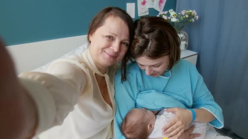 Grandma Recording Video in Maternity Hospital Room