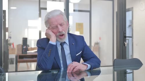 Restless Senior Businessman Sleeping
