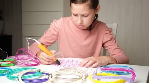 Girl Creates with 3D Pen at Home