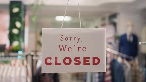 Closed Sign on Elegant Clothing Store
