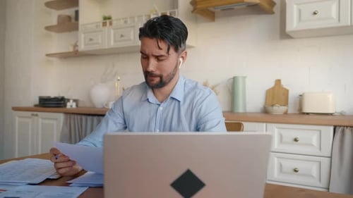 Man Working from Home at Kitchen Table
