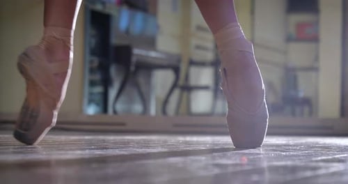 Ballerina Dancing on Pointe in Studio Close Up