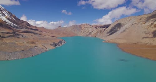 World's Highest altitude lake Tilicho at Nepal landscape hills shooting clouds and blue aesthetics,