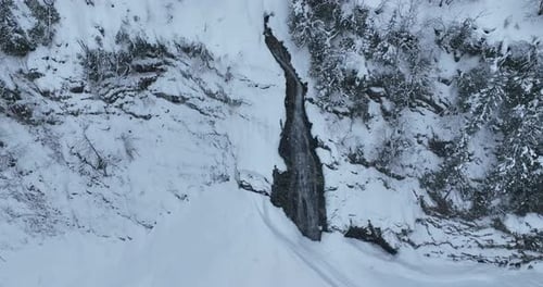 Snowy Waterfall Aerial View in Winter Wonderland