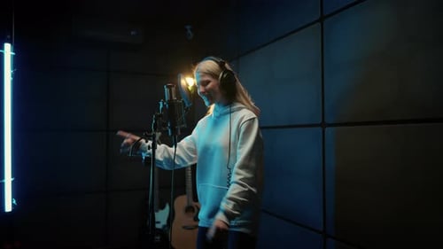 Woman Singer Recording Soundtrack in Modern Studio Talented Vocalist Singing Portrait of Young Adult