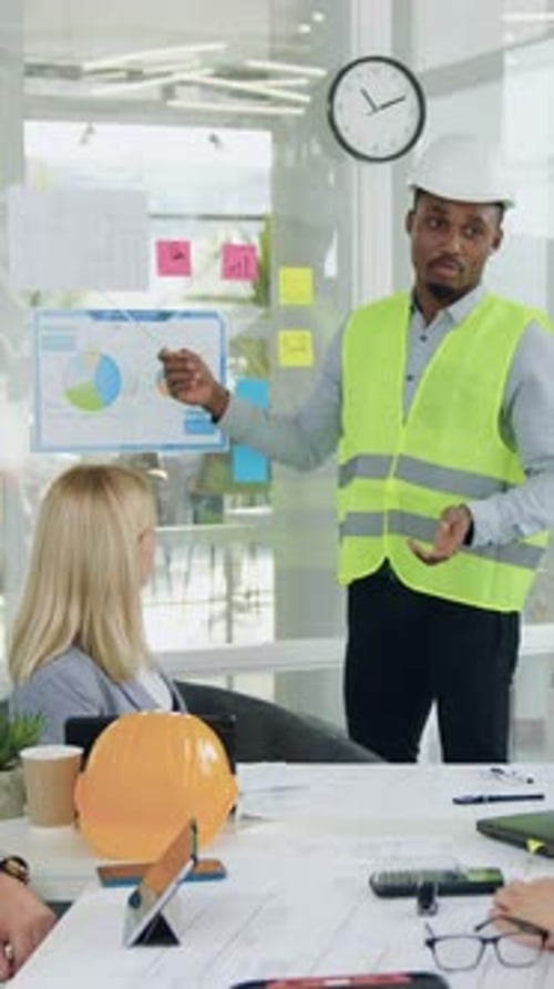 Close Up of Goodlooking Experienced Purposeful Blackskinned Specialist of Building Company in Vest